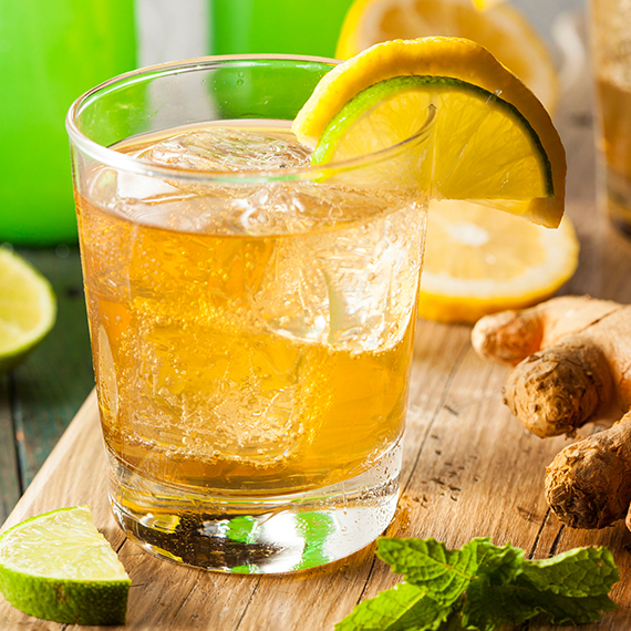 Caramel colors are not bad for you and are used to color many foods and beverages, like this example of whisky in a glass with a lime slice.